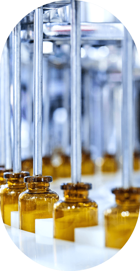 Brown medicine glass bottles on production line.