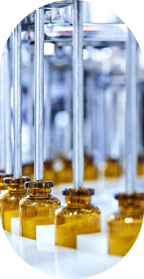 Brown medicine glass bottles on production line.