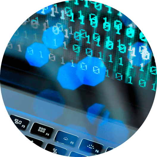 Fibre optic data containing a computer virus hitting a laptop screen.