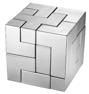 Silver completed puzzle cube on blue background